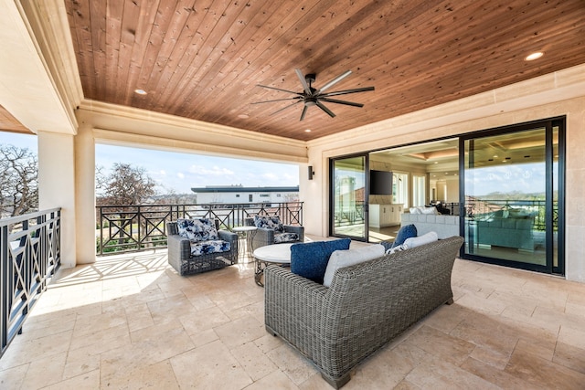 view of patio featuring an outdoor hangout area, a balcony, and ceiling fan