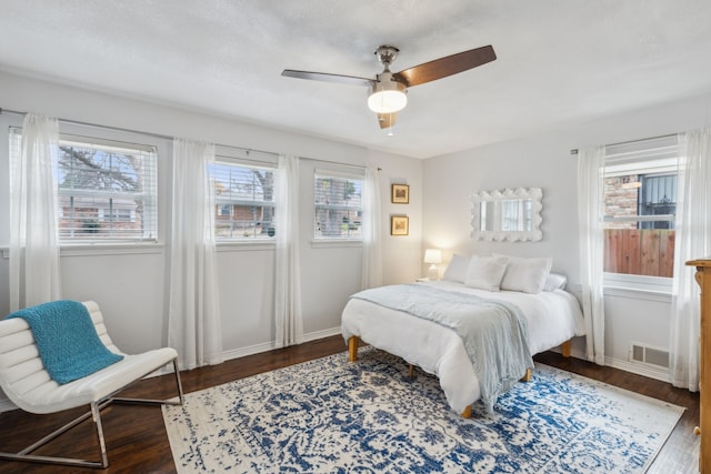 bedroom featuring ceiling fan and dark wood-type flooring