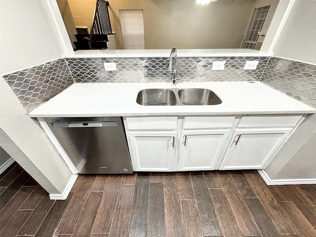 kitchen featuring sink, dark hardwood / wood-style floors, white cabinets, and dishwasher