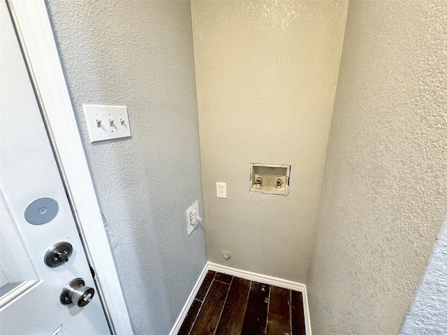 washroom featuring dark hardwood / wood-style flooring and washer hookup