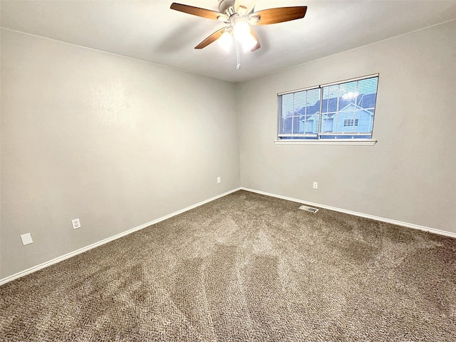 empty room with carpet floors and ceiling fan