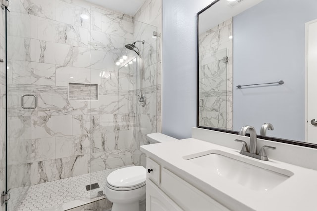 full bath featuring a shower stall, toilet, and vanity