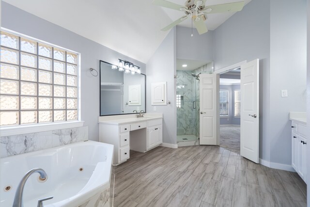 bathroom with hardwood / wood-style floors, vanity, lofted ceiling, plus walk in shower, and ceiling fan