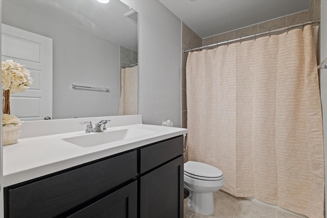 bathroom with toilet, walk in shower, tile patterned floors, and vanity