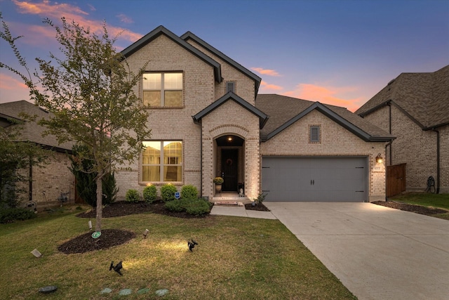 4113 Gainesway Ln, Aubrey, TX 76227 - view of front facade featuring brick siding, driveway, an attached garage, and a front yard