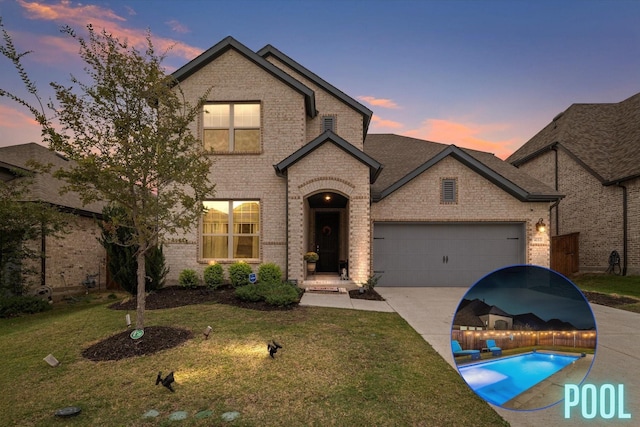 4113 Gainesway Ln, Aubrey, TX 76227 - view of front of home with brick siding, a yard, concrete driveway, and an attached garage