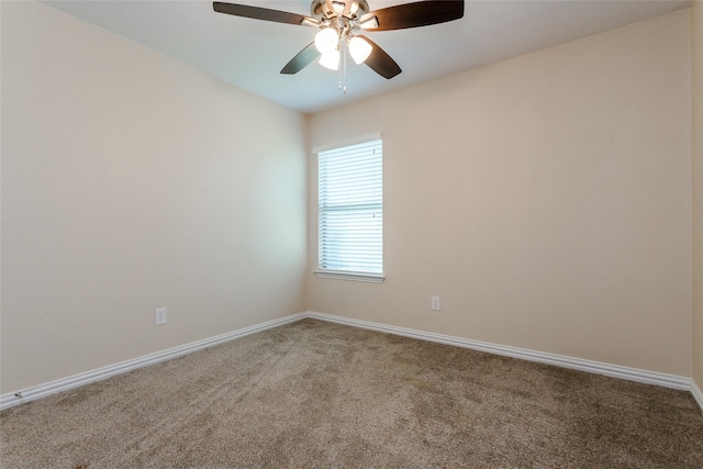 empty room featuring carpet and ceiling fan