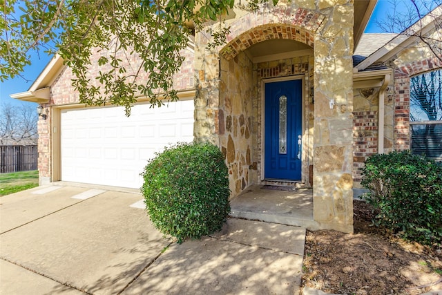 view of exterior entry with a garage