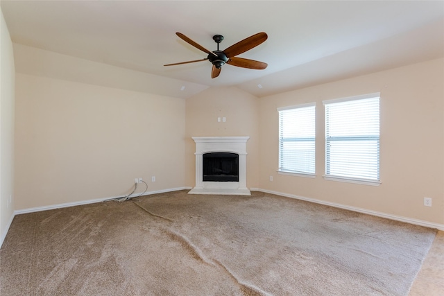 unfurnished living room featuring light carpet, vaulted ceiling, and ceiling fan