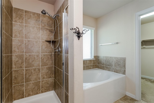 bathroom featuring tile patterned flooring and plus walk in shower