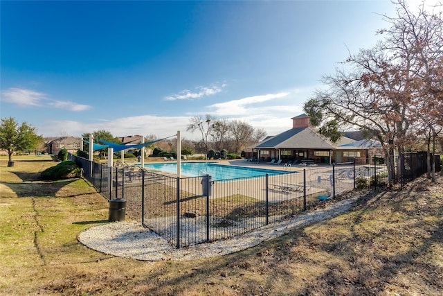 view of pool with a patio area and a yard