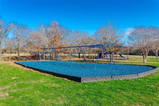 exterior space featuring a playground and a yard