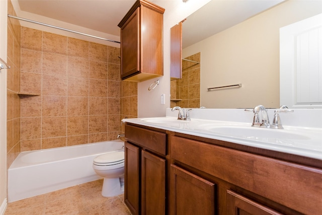 full bathroom featuring vanity, toilet, and tiled shower / bath