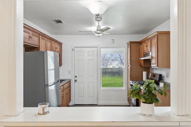 kitchen featuring stainless steel appliances and ceiling fan