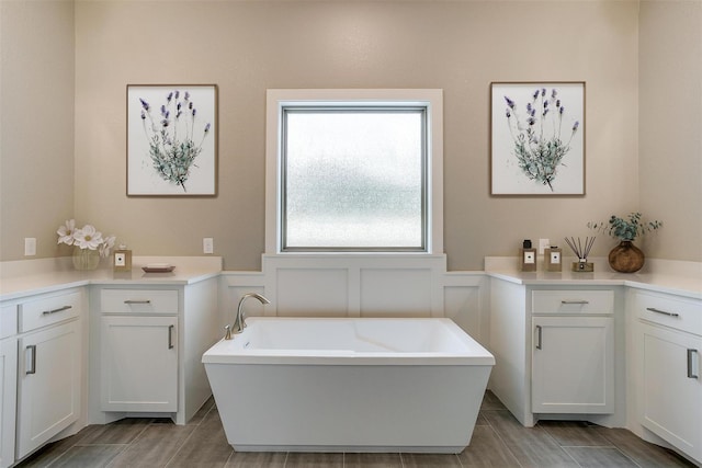 bathroom with vanity and a bathtub