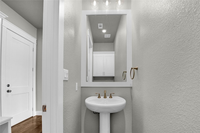 bathroom featuring hardwood / wood-style flooring