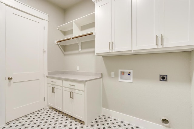 laundry area with cabinets, hookup for a washing machine, and electric dryer hookup