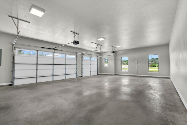 garage with a garage door opener and electric panel