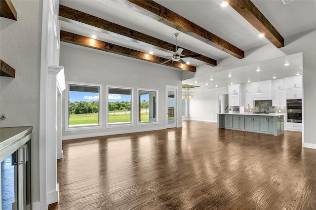 unfurnished living room with hardwood / wood-style flooring, ceiling fan, beamed ceiling, and wine cooler