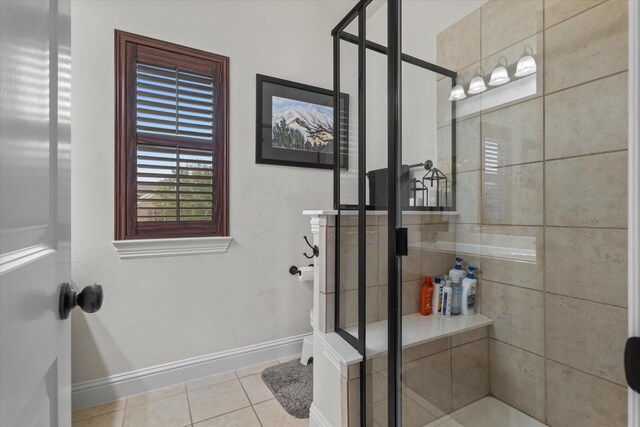 bathroom with tile patterned flooring and an enclosed shower