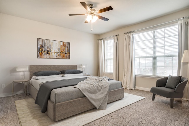 bedroom with light colored carpet and ceiling fan