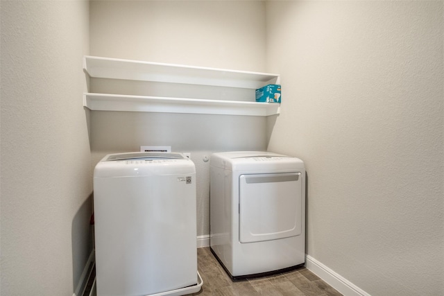 clothes washing area featuring washing machine and clothes dryer