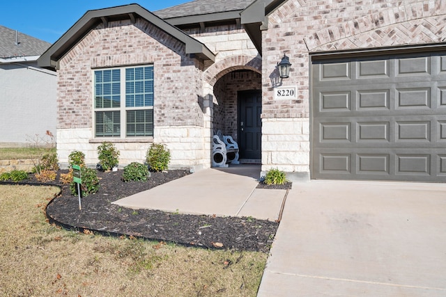 doorway to property featuring a garage