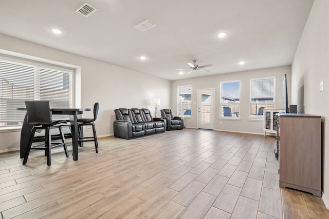 living room featuring ceiling fan