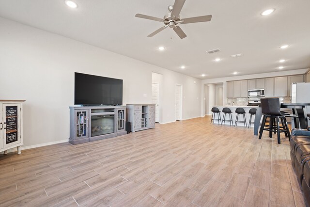 living room with ceiling fan