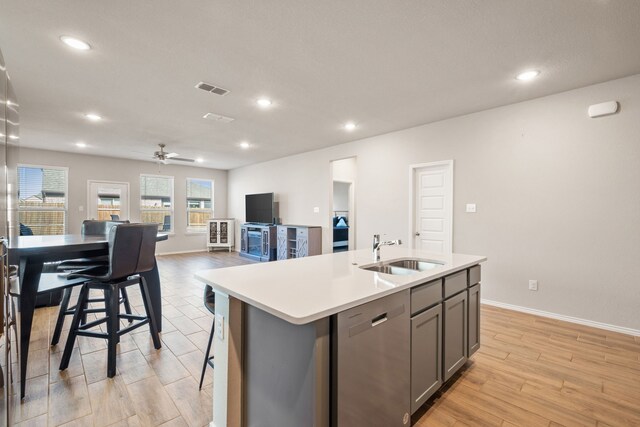 living room with ceiling fan and light wood-type flooring