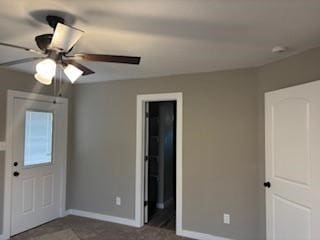 entrance foyer with ceiling fan