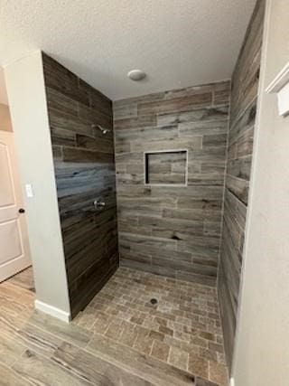 bathroom featuring a tile shower