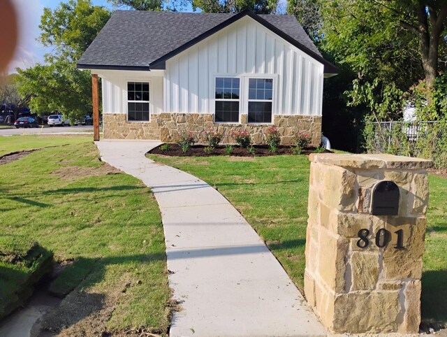 modern farmhouse with a front yard