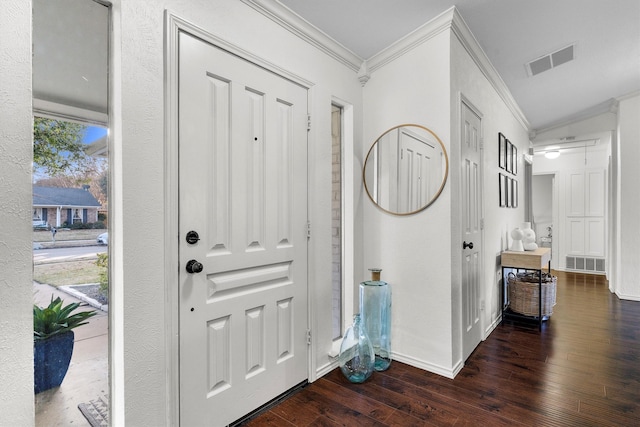 entrance foyer with crown molding, dark wood-type flooring, and a wealth of natural light