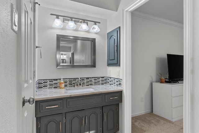 bathroom with vanity, decorative backsplash, and ornamental molding