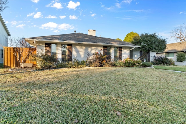 ranch-style house with a front lawn