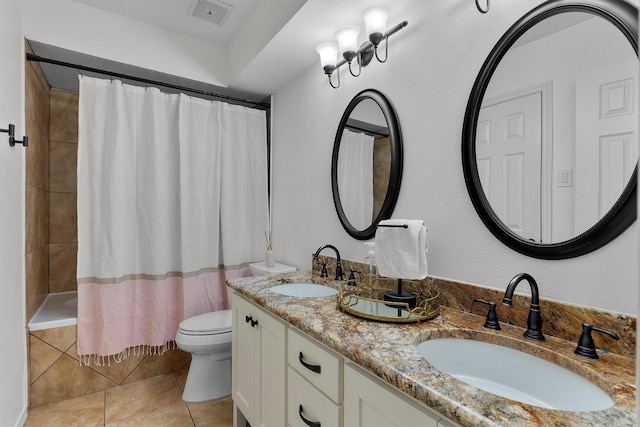 full bathroom featuring shower / tub combo with curtain, vanity, toilet, and tile patterned flooring