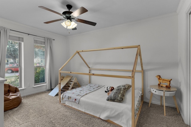 bedroom with multiple windows, crown molding, carpet flooring, and ceiling fan