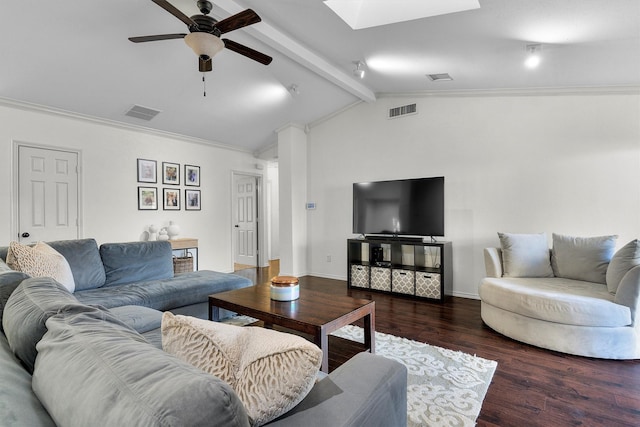 living room featuring ornamental molding, vaulted ceiling with skylight, ceiling fan, and dark hardwood / wood-style flooring