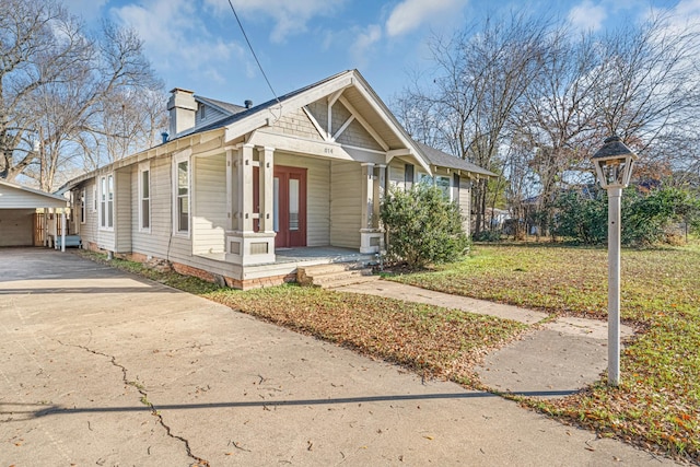 bungalow-style home featuring a carport