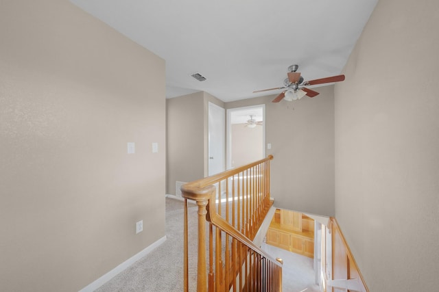 corridor with light colored carpet