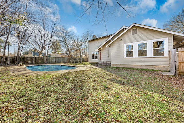 exterior space featuring a fenced in pool and a yard