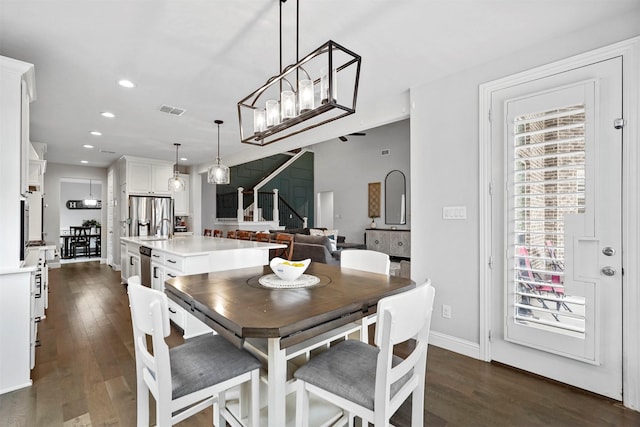 dining area featuring dark hardwood / wood-style flooring and sink