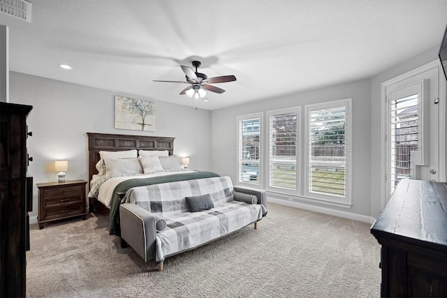 carpeted bedroom featuring ceiling fan