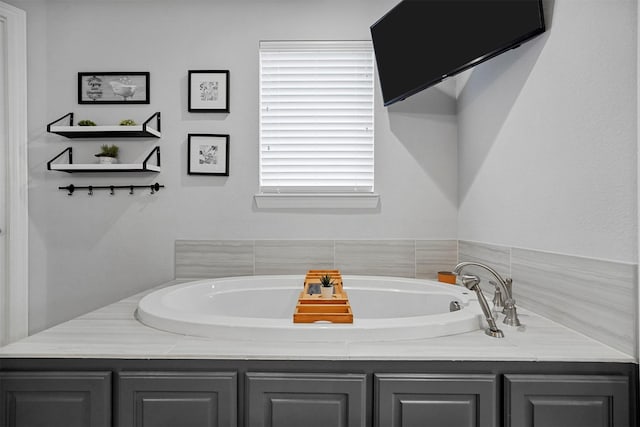 bathroom featuring a washtub