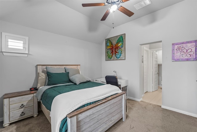 carpeted bedroom with ceiling fan and vaulted ceiling