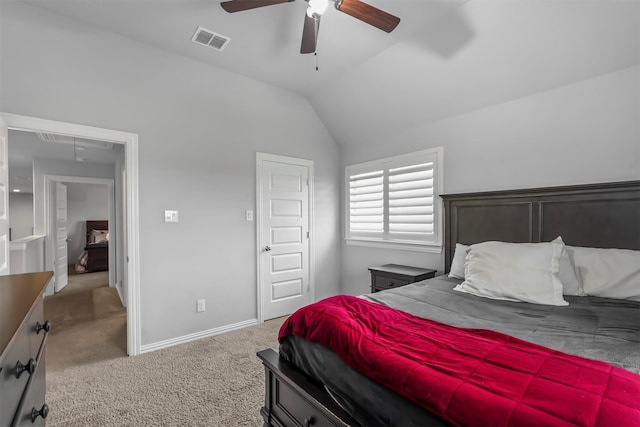 carpeted bedroom with ceiling fan and vaulted ceiling