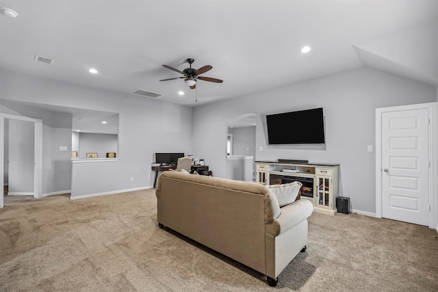 carpeted living room with lofted ceiling and ceiling fan