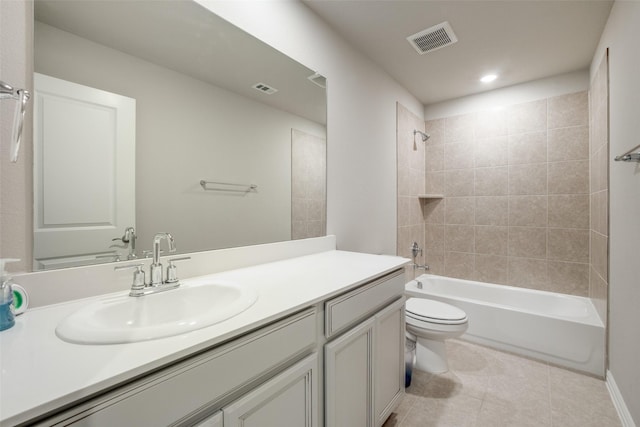 full bathroom with vanity, toilet, and tiled shower / bath