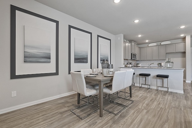 dining room with light hardwood / wood-style floors